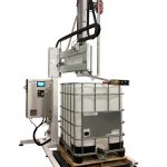 Bottom Up Net Weight Semi Automatic Liquid Filler for Drums and Totes. Painted with stainless steel parts for use with food products.